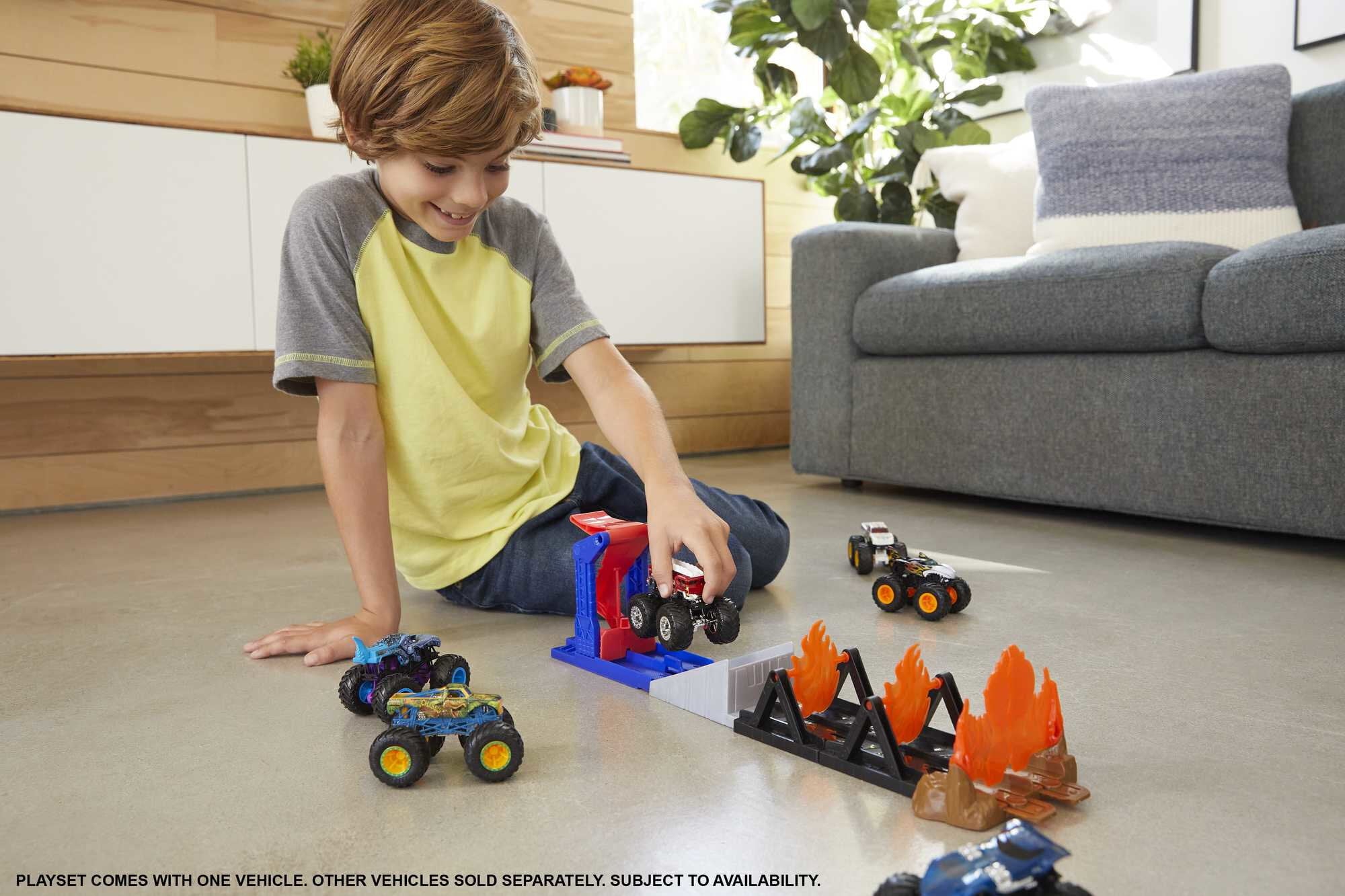 Hot Wheels Monster Trucks Fire Through Playset with 1:64 Scale 5-Alarm Toy Truck and Launcher